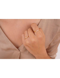 Anillo fino de circonitas en talla baguette engastadas en barra