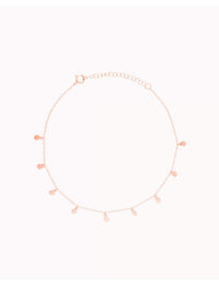 Pulsera tobillera con colgantes en forma de monedas