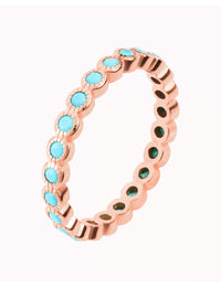 Anillo con circonitas de color turquesa engastadas en bezel