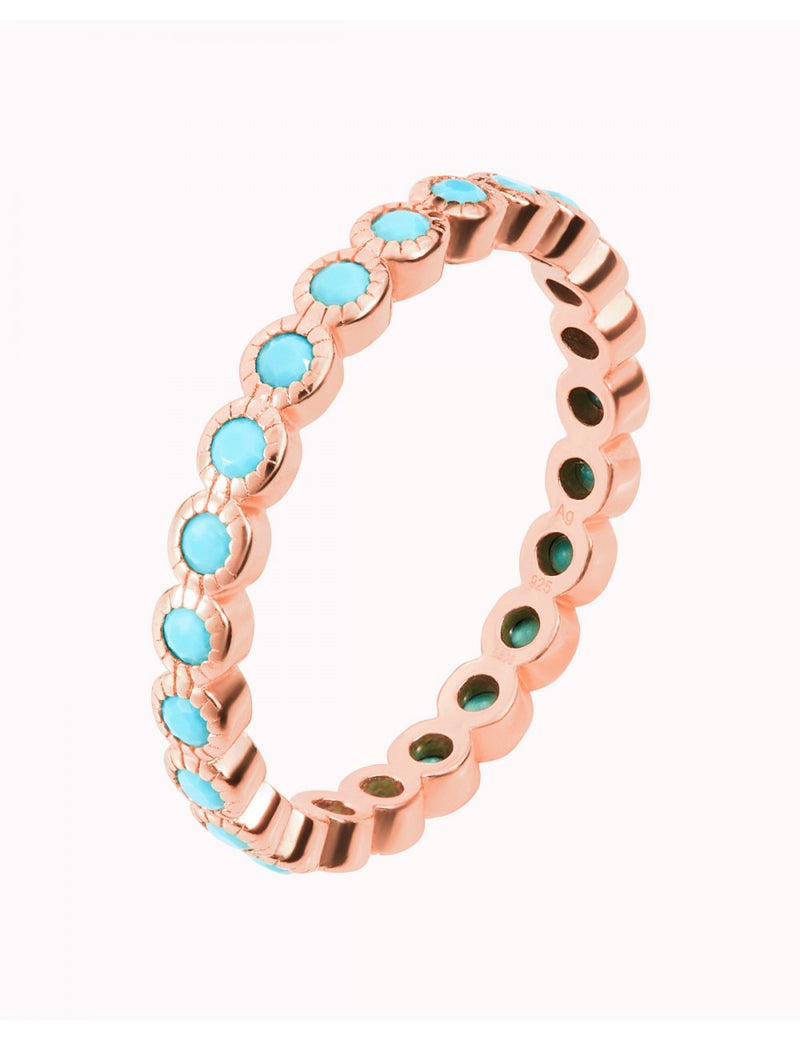 Anillo con circonitas de color turquesa engastadas en bezel